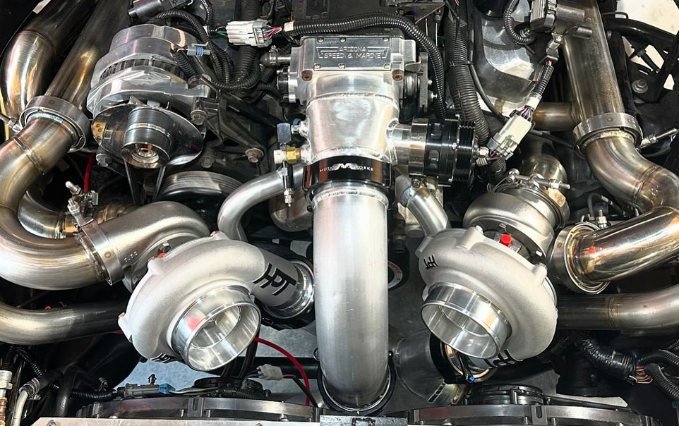 A pair or HPT Turbos installed on a coyote motor